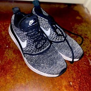 Black and white Nike flyknit Air Theta's